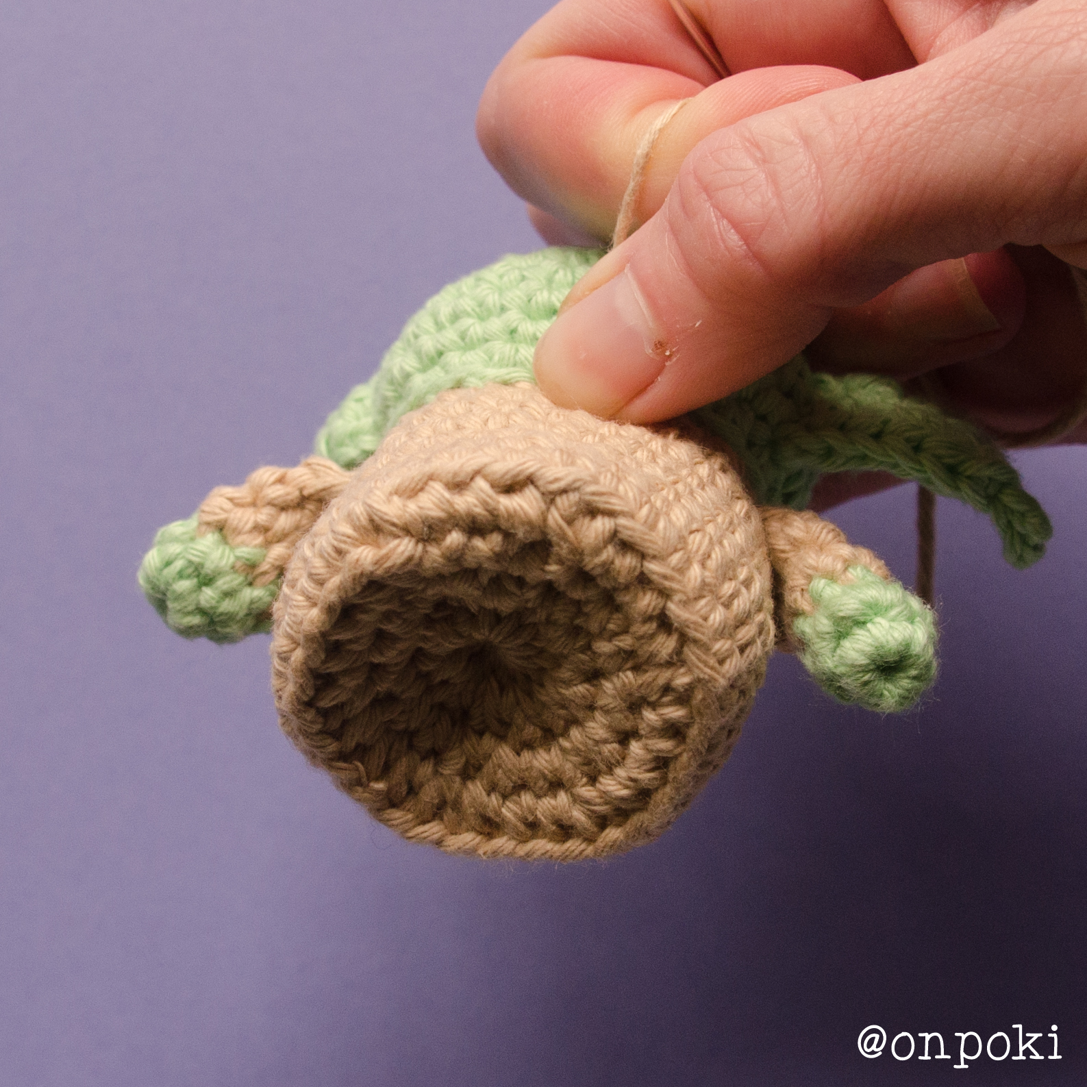 Pulling the yarn to shape Grogu’s base into a concave bottom