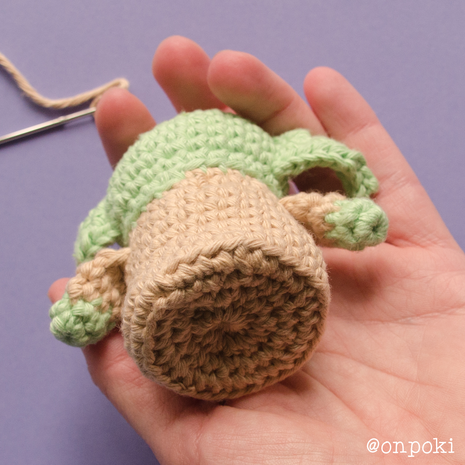 Grogu’s base secured with yarn to keep the concave shape